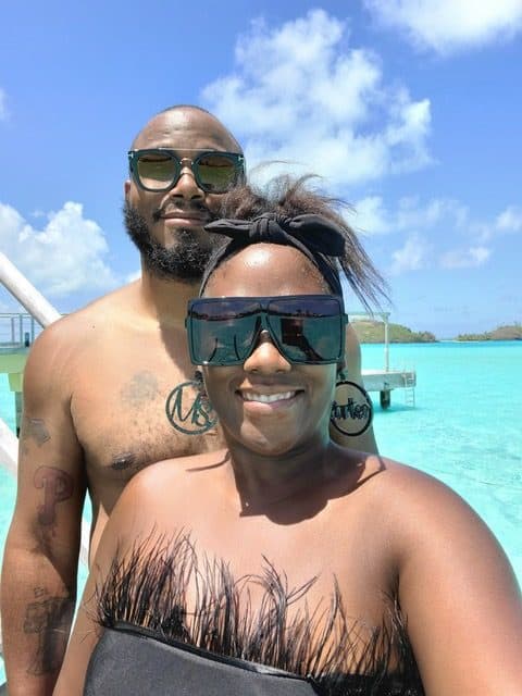 happy black couple at the beach