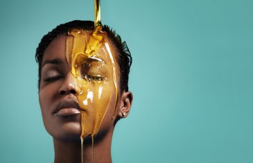 woman with a honey on her face