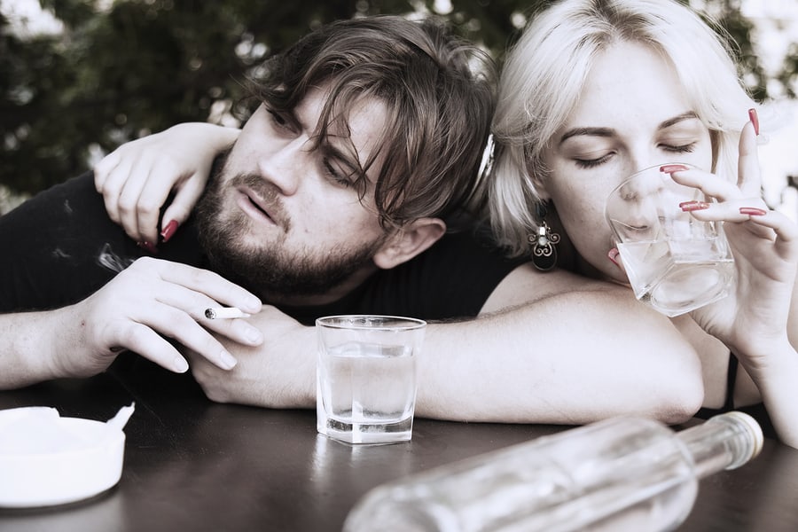 Couple smoking and drinking alcohol