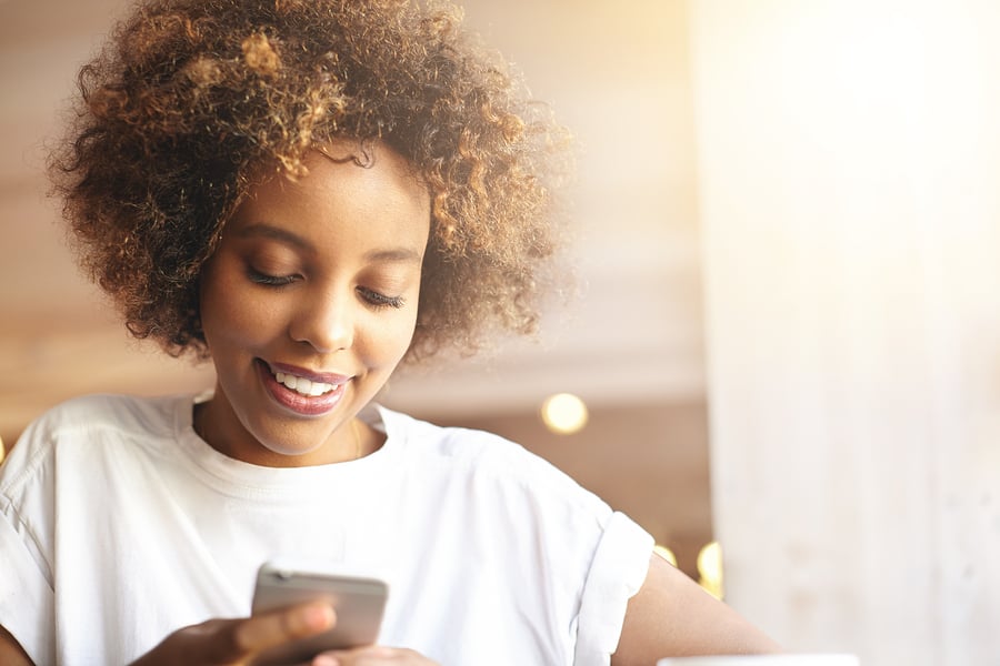 african woman texting