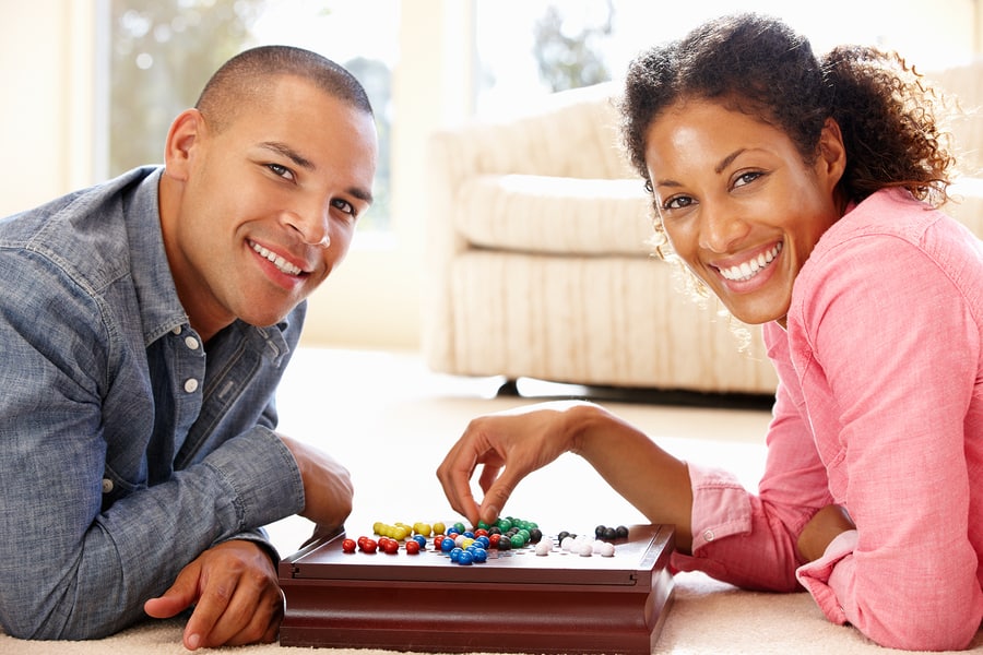 couple playing board game on date night