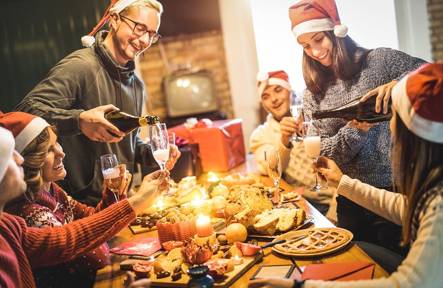 Families with santa hats celebrating Christmas