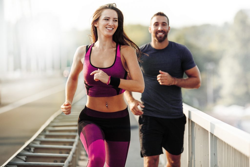 happy couple running in spring