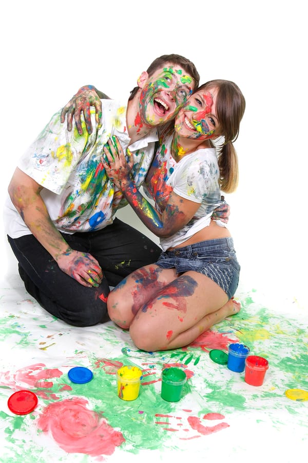 Young Happy Couple Painting