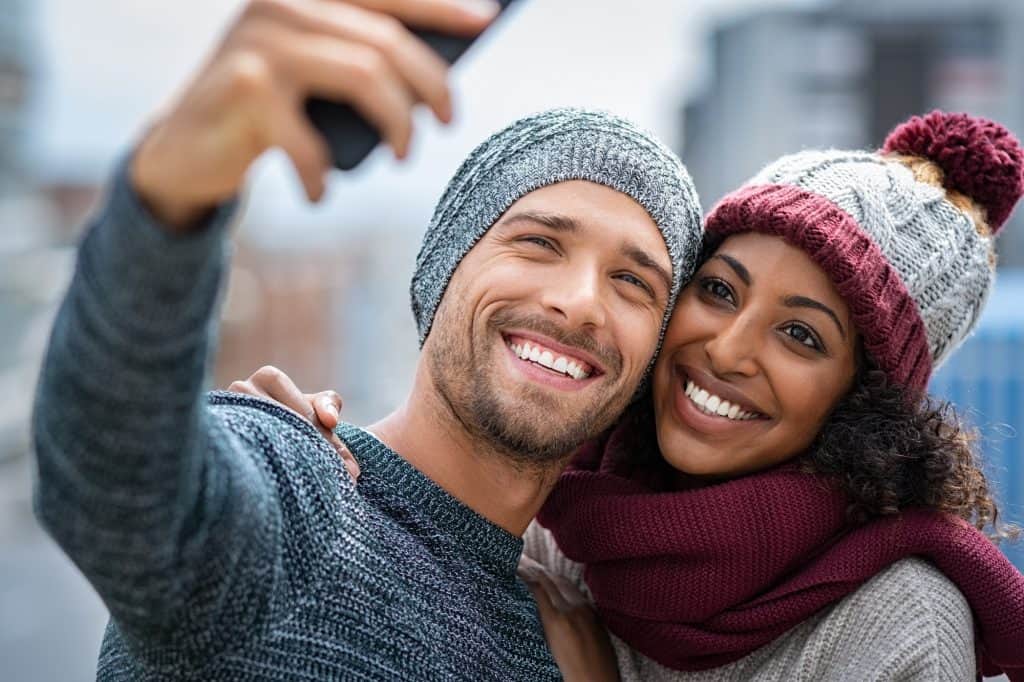 Happy multiethnic couple on christmas holidays.